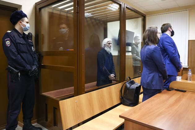 MOSCOW, RUSSIA - NOVEMBER 30, 2021: Unordained schema hegumen Sergius (Nikolai Romanov), centre back, charged with unsanctioned actions encouraging people to kill themselves and violating the right for freedom of religion over his calling on the faithful to oppose COVID-19 restrictions, attends a sententing hearing at Moscowâ€™s Izmailovsky District Court. The court found Romanov guilty on the three charges and sentenced him to 3 and a half years in prison colony. Romanov was arrested at the Sredneuralsk Convent and sent to Moscow on 29 December 2020; he was excommunicated in May 2020 for violating a ban on preaching after calling on people to go to church despite the lockdown, describing the coronavirus situation as a fake pandemic . More r  TS11A15C