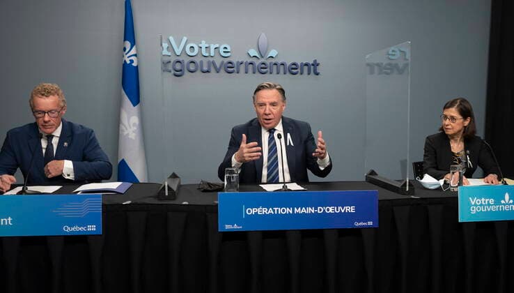 November 30, 2021, QUEBEC, PQ, Canada: Quebec Premier Francois Legault announces an operation to obtain more manpower, Tuesday, November 30, 2021 in Quebec City. Legault is flanked by Quebec Labour, Employment and Social Solidarity minister Jean Boulet, left, and Quebec Minister of Higher Education Danielle McCann. QUEBEC Canada  - ZUMAc35_ 20211130_zaf_c35_020 Copyright: xJacquesxBoissinotx