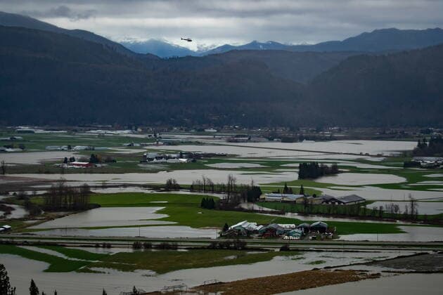 December 1, 2021, ABBOTSFORD, BC, CANADA: A helicopter flies over flooded farmland in Abbotsford, B.C., on Wednesday, December 1, 2021. ABBOTSFORD CANADA  - ZUMAc35_ 20211201_zaf_c35_107 Copyright: xDarrylxDyckx
