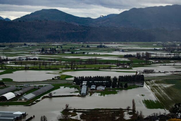 December 1, 2021, ABBOTSFORD, BC, CANADA: A helicopter flies over flooded farmland in Abbotsford, B.C., on Wednesday, December 1, 2021. ABBOTSFORD CANADA  - ZUMAc35_ 20211201_zaf_c35_112 Copyright: xDarrylxDyckx