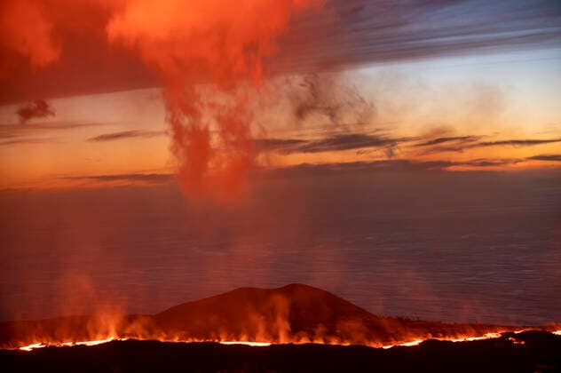 Creative Highlights World Dramatic scenery of burning lava flowing on rocky mountain slope in La Palma Island at night GabrielTrujillo_LaPalmaVolcano_26.jpg Copyright: xGabrielxTrujillox Model Released