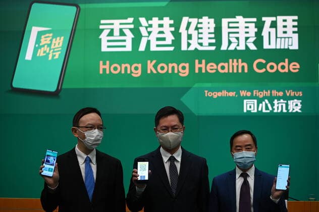 Hong Kong Government Announce Health Code From Left to Right Victor Lam Government Chief Information Officer, Alfred Sit Secretary for Innovation and Technology and Mr Tong Wong, Deputy Government Chief Information Officer holding up phones showing the new Leave Home Safe app during a press conference on the Hong Kong Health Code , December 2, 2021 in Hong Kong. Today the Government announced its the Hong Kong Health code which will be used for Quarantine free travel with Mainland China, Hong Kong has the strictest quarantine policies in the World with travelers arriving from most parts of the world requires to undergo a hotel quarantine of 21 days. Hong Kong Hong Kong  Copyright: xVernonxYuenx originalFilename:yuen-hongkong211202_npezB.jpg