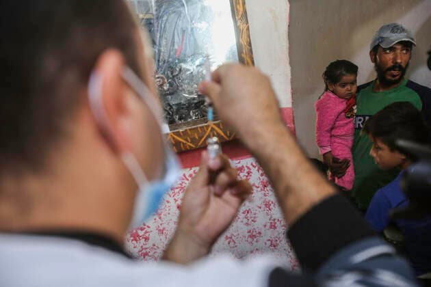 December 2, 2021, Gaza, Palestine: A health worker seen preparing the vaccine, during the campaign..UNICEF, Save Youth Future and the Palestinian Ministry of Health launched an awareness campaign about the importance of vaccination against the Coronavirus for Palestinian people especially after the new variant Omicron in the Bedouin Village southern Gaza City. Gaza Palestine - ZUMAs197 20211202_zaa_s197_075 Copyright: xAhmedxZakotx