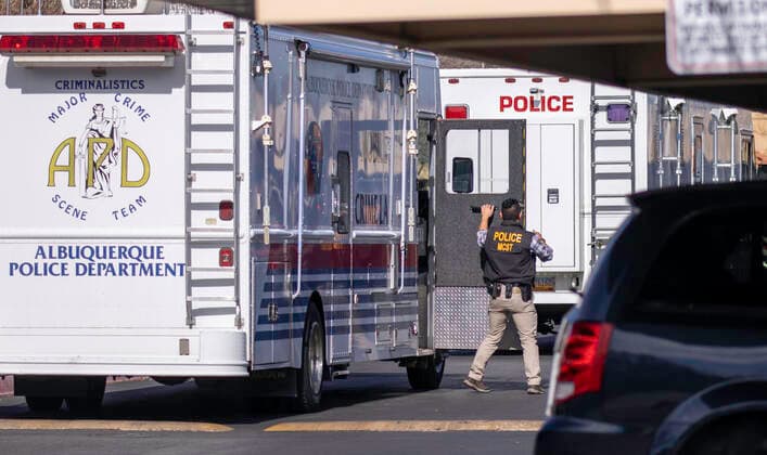 December 2, 2021, Albuquerque, New Mexico, USA: Albuquerque..A member from the Major Crime Scene Team (MCST) exits their Mobile Crime Lab at the Villa Hermosa apartment complex, as officers investigate an Officer Involved Shooting on December 02, 2021. for the Albuquerque Journal.Albuquerque, New Mexico Albuquerque USA - ZUMAab1_ 20211202_zaf_ab1_015 Copyright: xMikexSandovalx