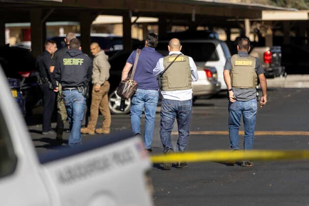 December 2, 2021, Albuquerque, New Mexico, USA: Albuquerque..Officers enter the parking lot of the Villa Hermosa apartment complex to investigate an Officer Involved Shooting on December 02, 2021. for the Albuquerque Journal.Albuquerque, New Mexico Albuquerque USA - ZUMAab1_ 20211202_zaf_ab1_010 Copyright: xMikexSandovalx