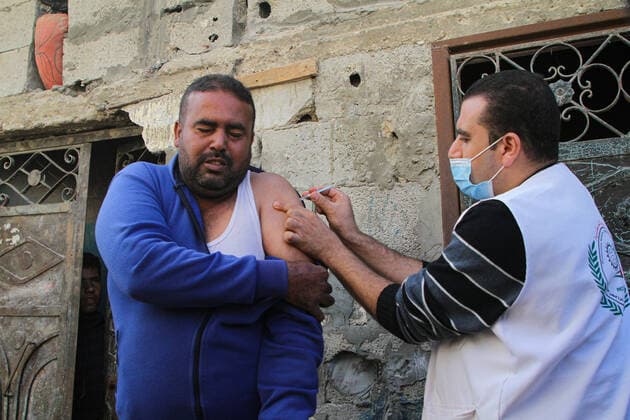(211202) -- GAZA, Dec. 2, 2021 -- A Palestinian man receives a dose of the COVID-19 vaccine during a vaccination campaign in Gaza City, on Dec. 2, 2021. (Photo by Xinhua) MIDEAST-GAZA CITY-COVID-19-VACCINATION RizekxAbdeljawad 