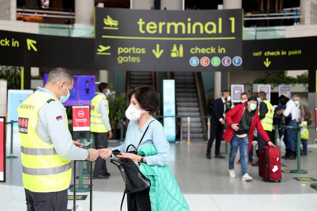 (211203) -- LISBON, Dec. 3, 2021 -- A traveler shows a negative test certificate as arriving at Humberto Delgado Airport in Lisbon, Portugal, on Dec. 1, 2021. The recent spike in COVID-19 infections, hospitalizations and deaths has prompted the authorities in Portugal to announce a return to the state of calamity on Dec. 1. The new measures include intensified health checks at the country s borders and the reinforcement of the vaccination campaign. (Photo by Xinhua) PORTUGAL-LISBON-COVID-19-MEASURES PedroxFiuza 