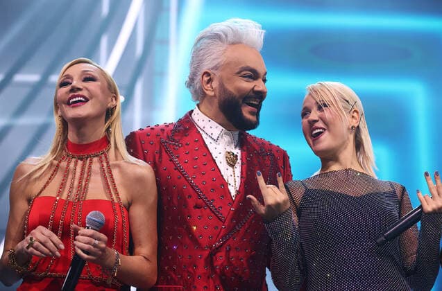 MOSCOW, RUSSIA - DECEMBER 4, 2021: Singers Kristina Orbakaite, Philipp Kirkorov and Klava Koka (L-R) perform during the Song of the Year 2021 concert at Megasport Arena. Artyom Geodakyan TASS  TS11AA52