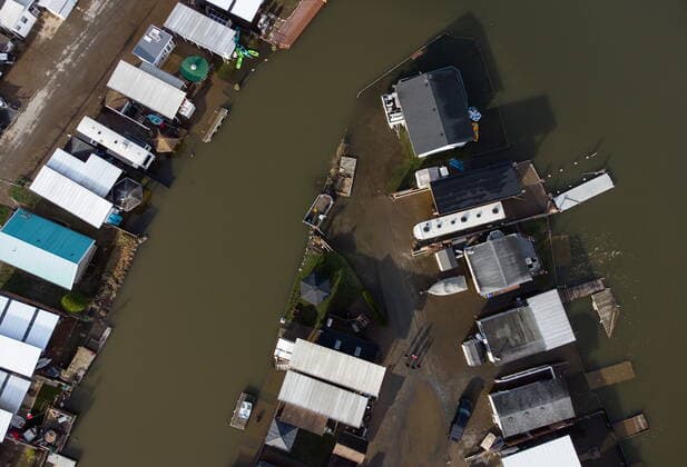 December 5, 2021, MISSION, BC, CANADA: Residents survey the aftermath as properties are surrounded by high water after floodwaters began to recede at Everglades Resort on Hatzic Lake near Mission, B.C., on Sunday, December 5, 2021. MISSION CANADA  - ZUMAc35_ 20211205_zaf_c35_105 Copyright: xDarrylxDyckx