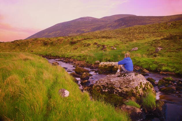 County Donegal, Ireland, Person Sitting On A Rock Copyright: DonxHammond 1789389