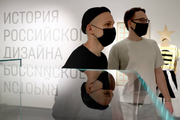 MOSCOW, RUSSIA â€“ DECEMBER 6, 2021: Men visit an exhibition titled The History of Russian Design â€“ The Best of 1917-2022 and held at the New Tretyakov Gallery, the first to feature a vast collection of the Moscow Design Museum. Artyom Geodakyan TASS  TS11AE01