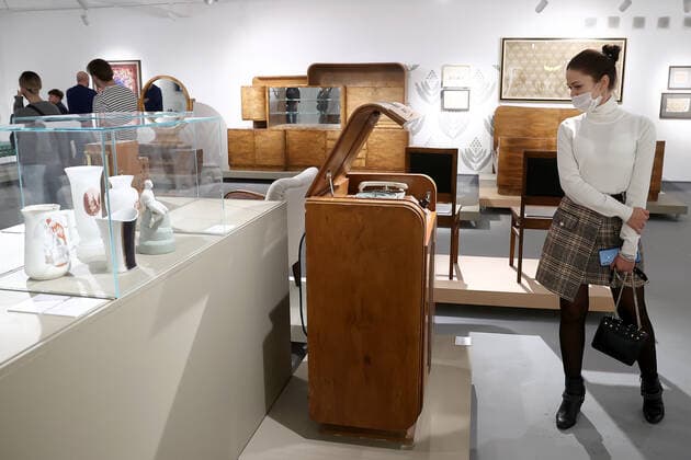 MOSCOW, RUSSIA â€“ DECEMBER 6, 2021: A woman visits an exhibition titled The History of Russian Design â€“ The Best of 1917-2022 and held at the New Tretyakov Gallery, the first to feature a vast collection of the Moscow Design Museum. Artyom Geodakyan TASS  TS11AE35