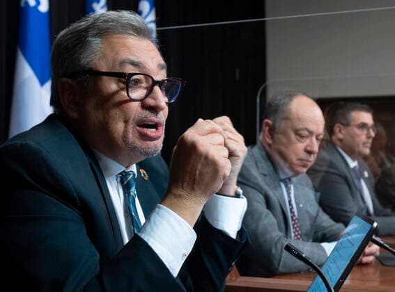 December 7, 2021, QUEBEC, PQ, Canada: Horacio Arruda, left, Quebec director of National Public Health responds to reporters questions during a news conference on the COVID-19 pandemic, Tuesday, December 7, 2021 at the legislature in Quebec City. Quebec Health Minister Christian Dube, centre and Daniel Pare, director of the vaccination campaign, look on. QUEBEC Canada  - ZUMAc35_ 20211207_zaf_c35_039 Copyright: xJacquesxBoissinotx