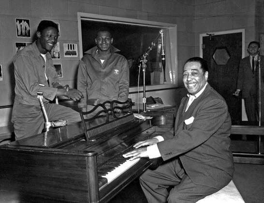Jazz pianist Duke Ellington poses Nov. 3, 1954, at the KFG Radio Studio for Fitzsimons Army Medical Center in Aurora, Colorado. Ellington played three shows at Travis Air Force Base, California, in the 1950s and 1960s, one of which was released as a live album in the 1980s. . . 1062_05_L_-10372-
