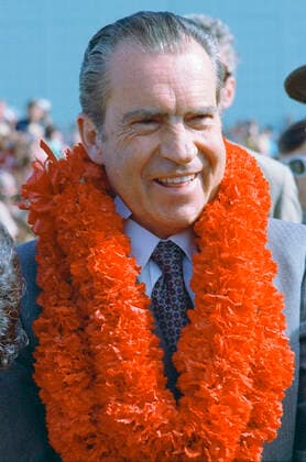 President Nixon wearing a lei at his welcoming ceremony for his Hawaiian stopover 1062_05_L_-11312-