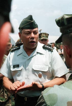 Gen. Colin Powell, chairman, Joint Chiefs of Staff, addresses a Marine during a visit to elements of the 2nd Marine Division departing the U.S. to participate in Operation Desert Shield. 1062_05_L_-9305-
