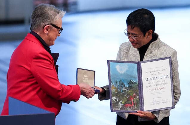 OSLO, NORWAY â€“ DECEMBER 10, 2021: Norwegian Nobel Committee Chairwoman Berit Reiss-Andersen (L) presents the 2021 Nobel Peace Prize to Filipino-American journalist, co-founder and CEO of Rappler Maria Ressa in recognition of her efforts to safeguard freedom of expression, which is a precondition for democracy and lasting peace , at a ceremony at Oslo City Hall. Sergei Bobylev TASS  TS11B5E4
