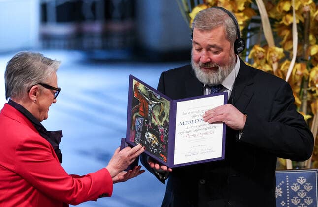 OSLO, NORWAY â€“ DECEMBER 10, 2021: Norwegian Nobel Committee Chairwoman Berit Reiss-Andersen (L) presents the 2021 Nobel Peace Prize to Russian journalist, Novaya Gazeta editor-in-chief Dmitry Muratov in recognition of his efforts to safeguard freedom of expression, which is a precondition for democracy and lasting peace , at a ceremony at Oslo City Hall. Sergei Bobylev TASS  TS11B5E2