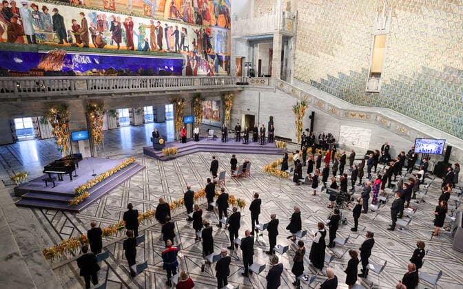 OSLO, NORWAY â€“ DECEMBER 10, 2021: Dmitry Muratov, 2021 Nobel Peace Prize winner, Russian journalist, Novaya Gazeta editor-in-chief, (in the middle back) stands during a minute s silence in memory of the killed journalists at the 2021 Nobel Peace Prize award ceremony at the Oslo City Hall. The Norwegian Nobel Committee has decided to award the Nobel Peace Prize for 2021 to Maria Ressa and Dmitry Muratov in recognition of their efforts to safeguard freedom of expression, which is a precondition for democracy and lasting peace . Sergei Bobylev TASS  TS11B61A