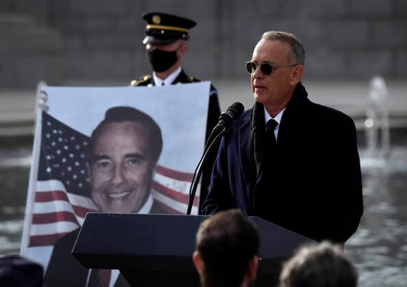 December 10, 2021, Washington, DC, USA: TOM HANKS speaks as mourners pay respects to the late Senator Bob Dole (R-KS) as the hearse makes a stop at a ceremony at the World War II Memorial in Washington DC on December 10, 2021. Washington USA - ZUMAg208 20211210_zap_g208_050 Copyright: xCarolxGuzyx