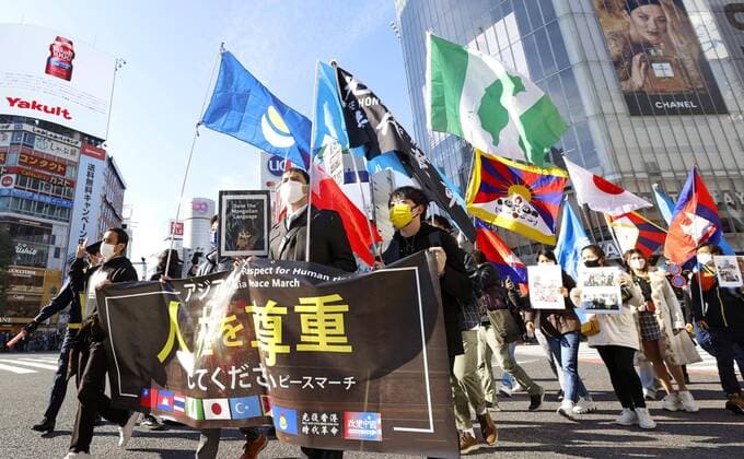 News Themen der Woche KW49 Human rights march in Tokyo About 300 people including Uyghurs and those from Myanmar and Hong Kong march in Tokyo s Shibuya area on Dec. 11, 2021, a day after World Human Rights Day.  A14AA0001167385P