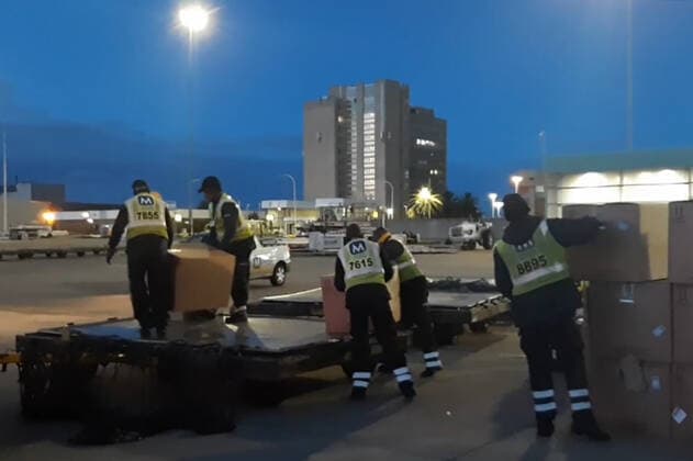 JOHANNESBURG, SOUTH AFRICA â€“ DECEMBER 14, 2021: Unloading cargo from a Russian Emergencies Ministry Ilyushin IL-76 transport aircraft at an airport in Johannesburg. Russia has sent a team of virologists, epidemiologists, Rospotrebnadzor and Russian Health Ministry medical workers, Russian Emergencies Ministry officers and a Kamaz lorry equipped with a mobile laboratory of the Rospotrebnadzor Agency to South Africa amid the COVID-19 pandemic. The mission has been ordered by Russiaâ€™s President Putin in response to a request from South African President Ramaphosa. On 25 November 2021, the South African Ministry of Health reported the emergence of the Omicron variant of SARS-CoV-2 which causes COVID-19. Russian Emergencies Ministry TASS THIS I  TS11BC20