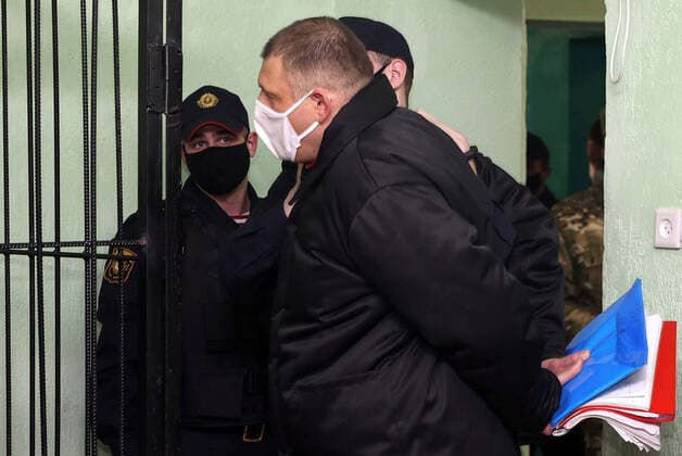 News Themen der Woche KW50 GOMEL, BELARUS â€“ DECEMBER 14, 2021: Belarusian blogger Sergei Tikhanovsky (front), husband of former Belarusian presidential candidate Svetlana Tikhanovskaya, attends a sentence hearing at the Gomel Regional Court. Tikhanovsky has been sentenced to 18 years in prison for organizing mass unrest. Sergei Kholodilin BelTA TASS  TS11BD02