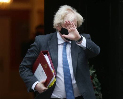 December 15, 2021, London, England, United Kingdom: UK Prime Minister BORIS JOHNSON leaves 10 Downing Street ahead of the weekly Prime MinisterÃ¢â‚¬â ¢s Questions session in the House of Commons. London United Kingdom - ZUMAs262 20211215_zip_s262_017 Copyright: xTayfunxSalcix
