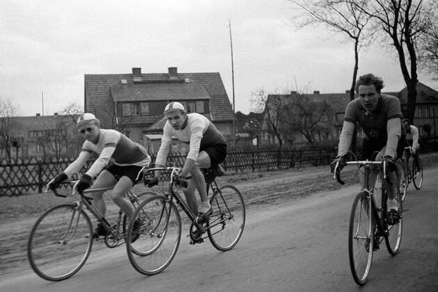 Cycling Race Berlin - Angermünde 1952 Bicycle Race Berlin - Angermünde in spring 1952. Three athletes on the road. Historical image from GDR. German Democratic Republic. East Germany.