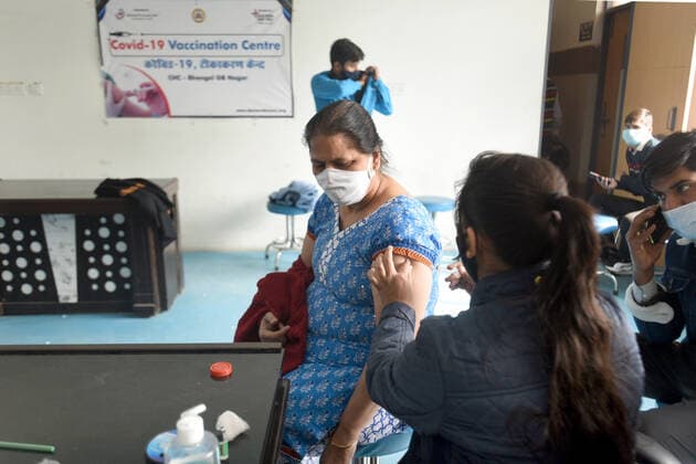 NOIDA, INDIA - DECEMBER 18: A person being vaccinated against Covid-19 at Bhangel PHC in Sector 110, on December 18, 2021 in Noida, India. (Photo by Sunil Ghosh Hindustan Times ) Daily Life Amid Coronavirus Pandemic In India