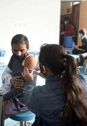 NOIDA, INDIA - DECEMBER 18: A person being vaccinated against Covid-19 at Bhangel PHC in Sector 110, on December 18, 2021 in Noida, India. (Photo by Sunil Ghosh Hindustan Times ) Daily Life Amid Coronavirus Pandemic In India