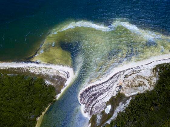 Aerial view of Punta Allen Sian Ka an Reserve, Yucatan Peninsula, Mexico. Boca Paila Bridge. In the language of the Mayan peoples who once inhabited this region, Sian Ka an means Origin of the Sky. Located on the east coast of the Yucatan peninsula, this biosphere reserve contains tropical forests, mangroves and marshes, as well as a large marine section intersected by a barrier reef. It provides a habitat for a remarkably rich flora and a fauna comprising more than 300 species of birds, as well as a large number of the region s characteristic terrestrial vertebrates, which cohabit in the diverse environment formed by its complex hydrological system. Along its roughly 120 kilometres of coastline, the property covers over 400,000 hectares Copyright: xSergixReboredox SRE-040-ER2415