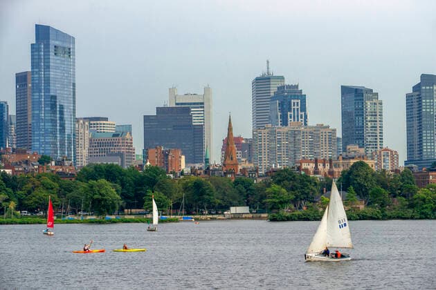 Sail boats in Boston Harbor, Boston against the cityscape of Back Bay Boston, Massachusetts, USA from across the Charles River Boston Massachusetts USA Copyright: xSergixReboredox SRE-EP0745