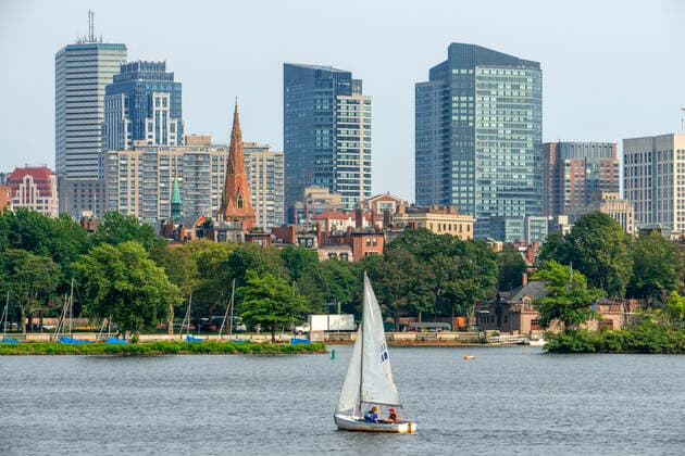 Sail boat in Boston Harbor, Boston against the cityscape of Back Bay Boston, Massachusetts, USA from across the Charles River Boston Massachusetts USA Copyright: xSergixReboredox SRE-EP0764