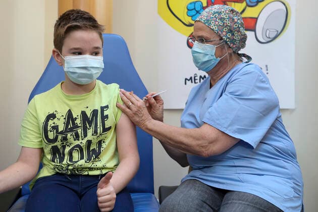Illustration picture shows a child getting his vaccine during the opening of the vaccination for kids from five to eleven years old, Wednesday 22 December 2021, at the Pacheco test and vaccination centre.  NICOLASxMAETERLINCK 3161070
