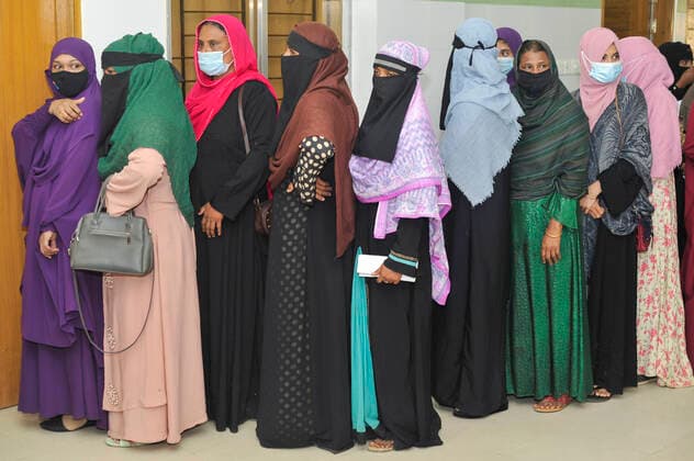 Mass Vaccination Campaign Continue To Prevent Infection SYLHET, BANGLADESH - DECEMBER 23, 2021: Women queue to be able receive a Pfizer dose against Covid-19 disease at the MAGO smani medical college & hospital vaccination center, during mass vaccination campaign for elderly, to reinforce their immune system and prevent them infected with Sars-Cov-2 . On December 23, 2021 in Sylhet, Bangladesh. (Photo by Md Rafayat Haque Khan Eyepix Group) Copyright: xMdxRafayatxHaquexKhanx xEyepixxGroupx EYEPIXGROUP_MRHK_23122021_21846