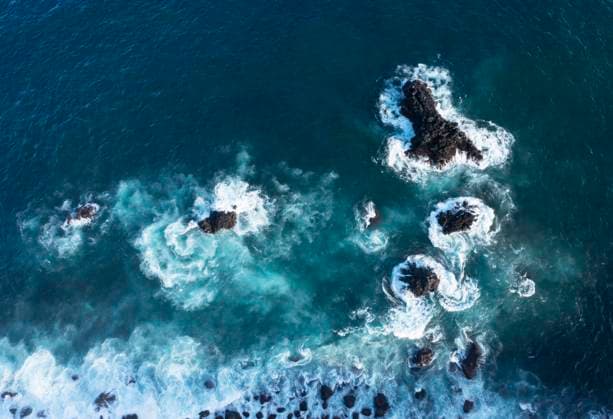 Creative Highlights World Drone view of blue coastal waters of Sao Miguel Island, WWF05924