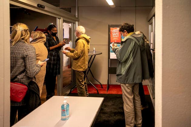 A covid safe ticket (CST) is scanned ahead of the Demain c etait mieux. Non peut-etre show at the Centre Culturel venue in Auderghem - Oudergem, Brussels on Wednesday 29 December 2021. Yesterday the Council of State (Raad Van State - Conseil d Etat) overturned the decision to close theaters as a corona-measure.  HATIMxKAGHAT 3163864