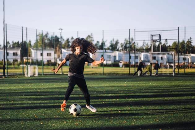 Female athlete playing soccer on sports field Sweden, Stockholm, model released Copyright: xMaskotx , MA91386