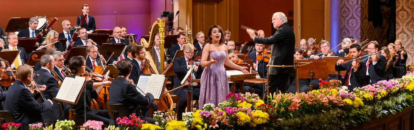 Austrian conductor Manfred Honeck and soprano of Kyrgyzstan Katharina Konradi perform during the New Year concert of Czech Philharmonic in Prague, Czech Republic, January 1, 2022. (CTKxPhoto VitxSimanek) CTKPhotoP2022010103983  VIS 006 K