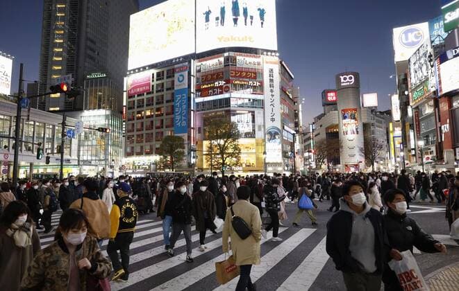 Scene of Tokyo amid coronavirus pandemic People wearing face masks walk in Tokyo s Shibuya district on Jan. 3, 2022, amid the coronavirus pandemic.  A14AA0001175315P