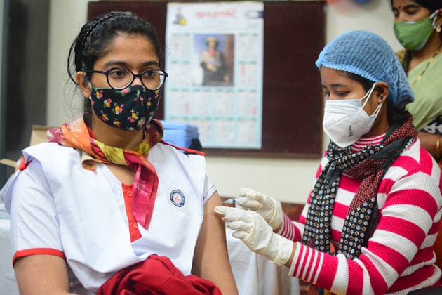 India: Vaccination for age between 15 to 18 years Health workers were giving vaccines to students aged between 15 to 18 years old in school. Schools were closed from today due to the number of covid and Omicron cases increased. School students came to their school for vaccination. After vaccination they were sent to the observation room. Kolkata West Bengal India Copyright: RahulxSadhukhan