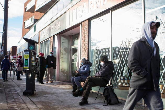 January 3, 2022, TORONTO, ON, CAN: People stand in line outside a pharmacy in Toronto which offered walk in vaccines for teachers, school staff and daycare workers, on Monday, January 3, 2022. TORONTO CAN  - ZUMAc35_ 20220103_zaf_c35_033 Copyright: xChrisxYoungx