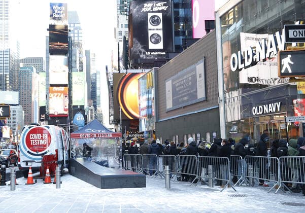 People wait in line to be tested for COVID-19 at a mobil testing site parked Times Square in New York City on Tuesday, January 4, 2022. The United States continues to set records for positive COVID cases.  NYP20220104123 JohnxAngelillo
