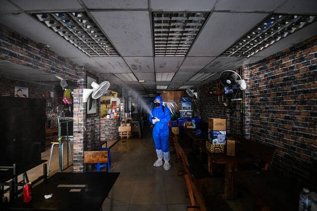 Thailand: Clean-up after revelers tested positive for COVID-19 coronavirus at a tourist spot A Thai volunteer staff in a protective suit sprays disinfectant at a nightclub and restaurant during a clean-up operation after revelers tested positive for COVID-19 coronavirus at a tourist spot in Khao San road, during COVID-19 coronavirus infections linked with the Omicron variant have been detected putting Thailand at risk of a new wave hit by the pandemic. Thailand Copyright: VichanxPoti