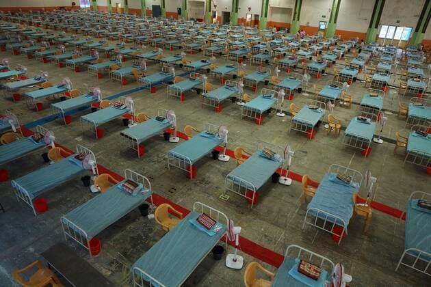 January 7, 2022, Chennai, Tamil Nadu, India: Indian workers install beds at a makeshift COVID-19 coronavirus isolation ward with more than 900 beds inside Chennai Trade Centre in Chennai. StateÃ‚ governments in India are enforcing more severe travel restrictions and partial lockdowns as the country struggles to deal with the third Covid-19 pandemic and rising omicron infections. Chennai India - ZUMAl172 20220107_zip_l172_001 Copyright: xSrixLoganathanx