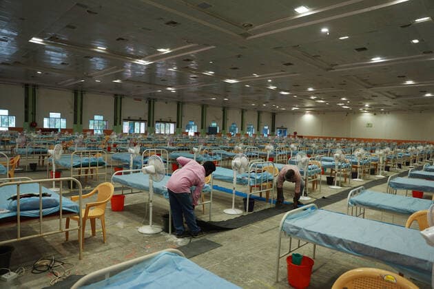 January 7, 2022, Chennai, Tamil Nadu, India: Indian workers install beds at a makeshift COVID-19 coronavirus isolation ward with more than 900 beds inside Chennai Trade Centre in Chennai. StateÃ‚ governments in India are enforcing more severe travel restrictions and partial lockdowns as the country struggles to deal with the third Covid-19 pandemic and rising omicron infections. Chennai India - ZUMAl172 20220107_zip_l172_004 Copyright: xSrixLoganathanx