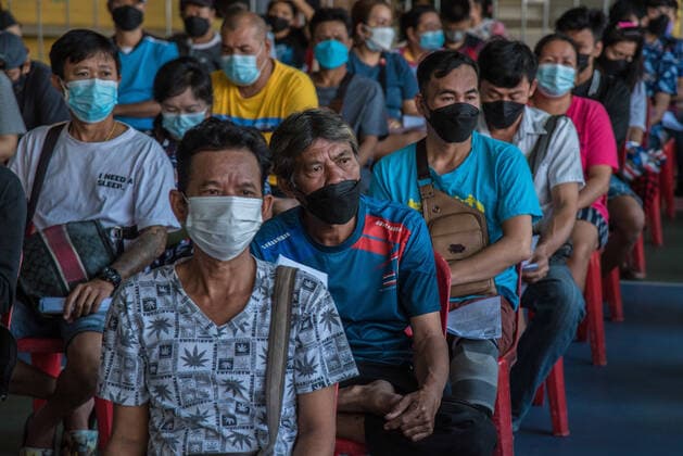 January 8, 2022, Bangkok, Thailand: People wait to be vaccinated with doses of AstraZeneca Covid-19 vaccine at Wat Bangkhuntian Nok School in Bangkok..Thailand has accelerated Covid-19 vaccination shots and booster shots to contain the surge of COVID-19 coronavirus infections linked with the Omicron variant that is spreading in many areas of the country. Thailand s government decided to closed some public areas and limited the number of people gathering to contain a rapid surge of the outbreak after more than 5,000 COVID-19 coronavirus infections linked with the Omicron variant have been detected. Bangkok Thailand - ZUMAs197 20220108_zaa_s197_034 Copyright: xPeeraponxBoonyakiatx