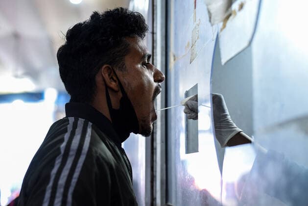 January 8, 2022, Guwahati, India: A health worker collects swab sample for COVID-19 testing at Guwahati Railway Station, in Guwahati, Assam, India on Saturday, Jan. 8, 2022. Daily cases of Covid-19 surged by 21% in 24 hours as India recorded more than hundred thousand fresh infections. Guwahati India - ZUMAt232 20220108_zip_t232_014 Copyright: xDavidxTalukdarx