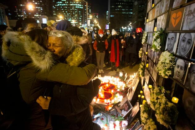 January 8, 2022, TORONTO, ON, Canada: Akram Shojae (second right) is comforted at a vigil in Toronto on Saturday, January 8, 2022 as she mourns her son, Amir Hossein Ovaysi, daughter-in-law Sara Hamzeei and grandchild Asal Ovaysi who were among the 176 victims of Ukraine International Airlines Flight PS752 that was shot down in Iranian forces two years ago. TORONTO Canada  - ZUMAc35_ 20220108_zaf_c35_128 Copyright: xChrisxYoungx